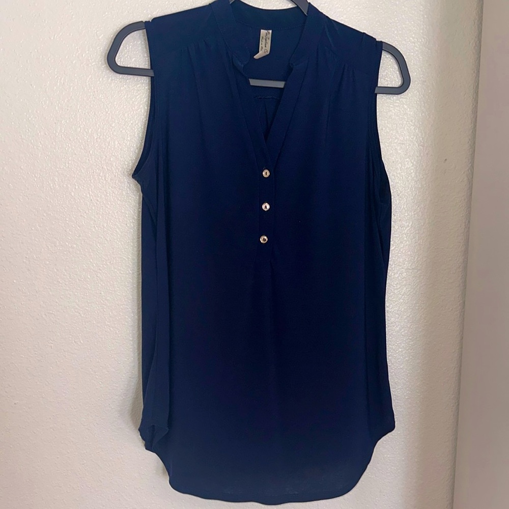 Navy blue tank top with three gold buttons 95% polyester, lightweight.